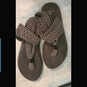 Black and white Sanuk Sandals